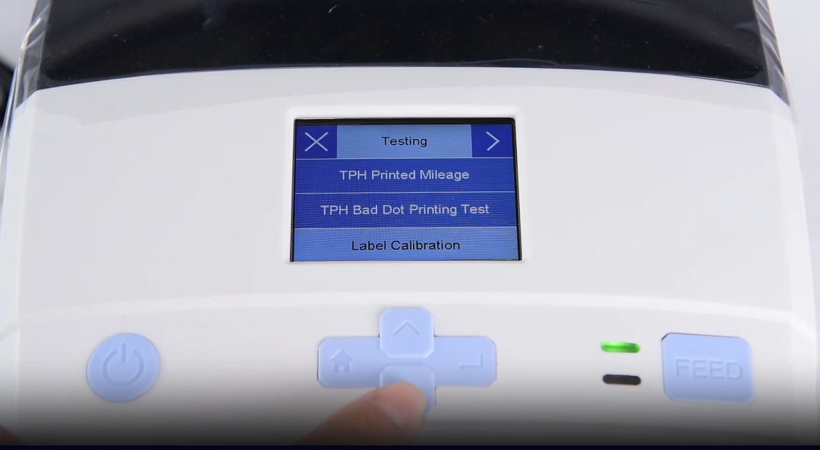 Một close-up of a machine's digital interface showing a testing menu.